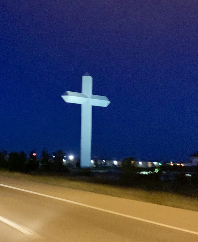 Illuminated Cross beside the Road