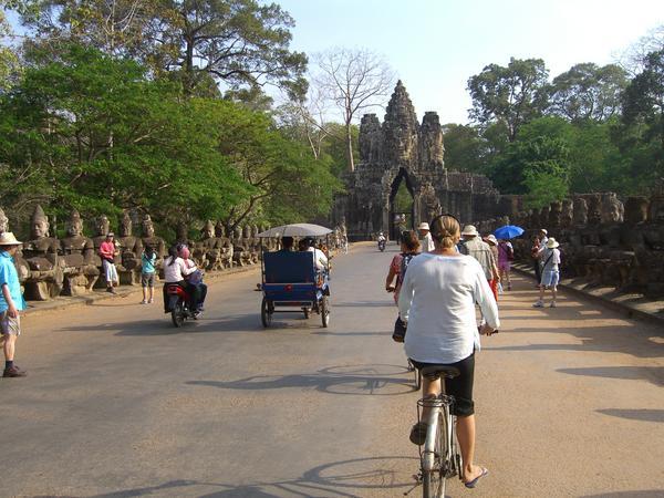 Cycling into the South Gate of Angkor Thom