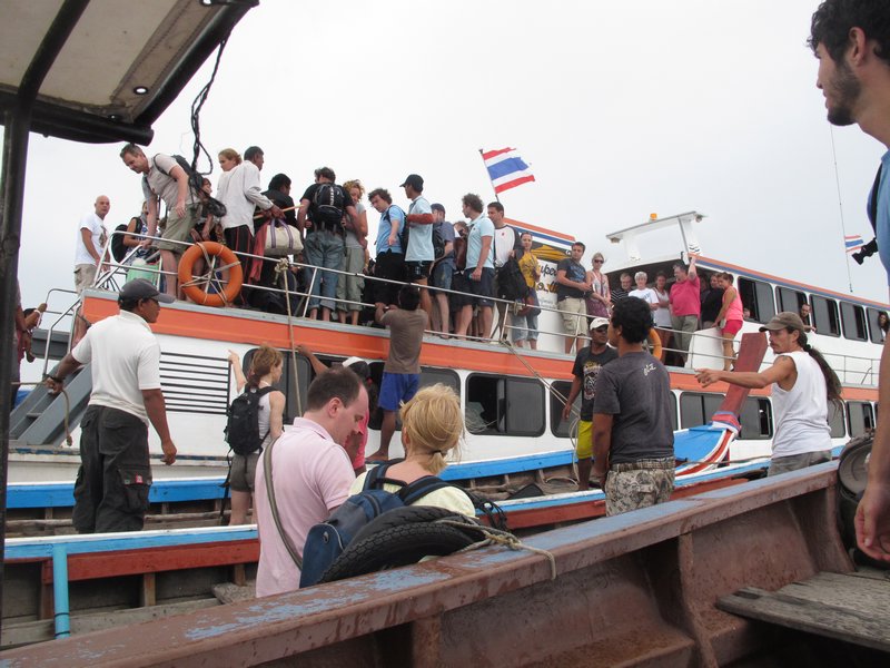 Transferring from ferry to longtail in the middle of the sea - Koh Jam