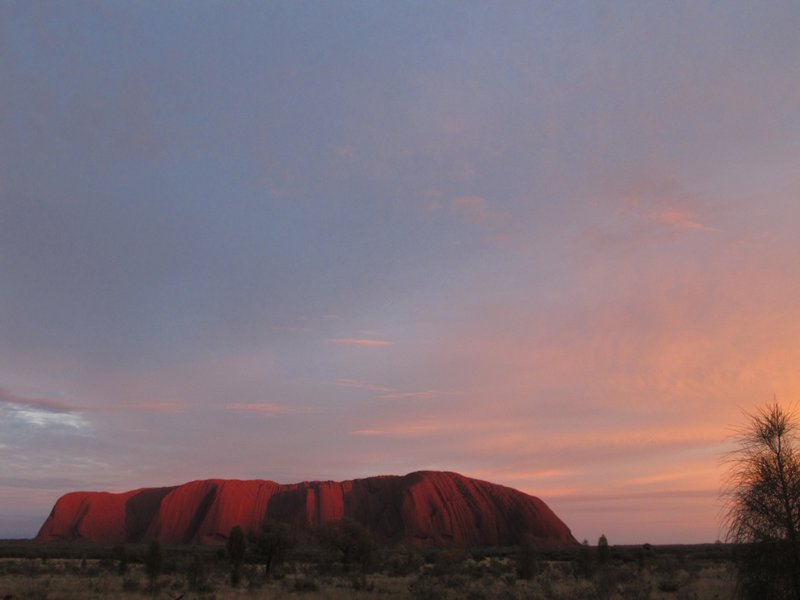 Sunrise approaches Uluru