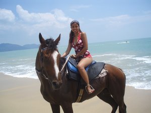 Horse riding in the beach