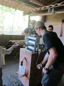 Evan pressing the sugar cane (to get the sugar water out) 