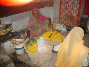 women selling flowers near temple