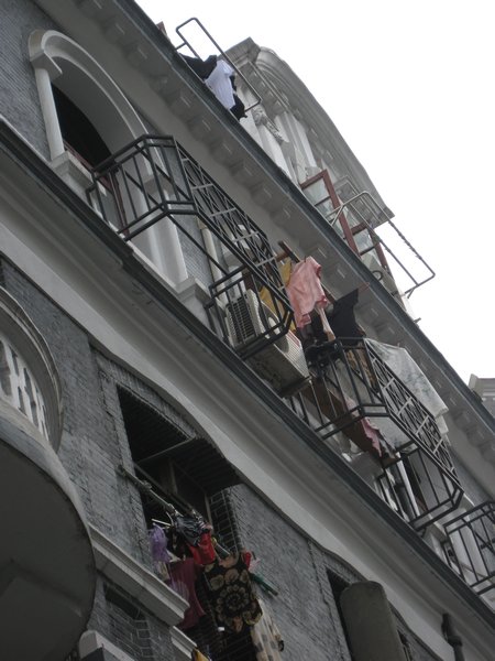 Laundry hanging from colonial building near the Bund