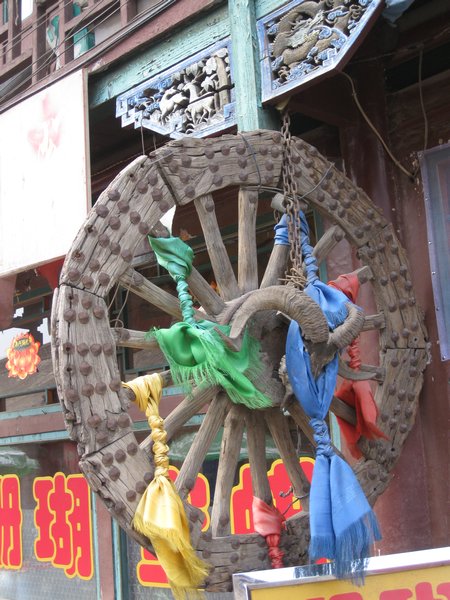 Wheel with ram skull and flags