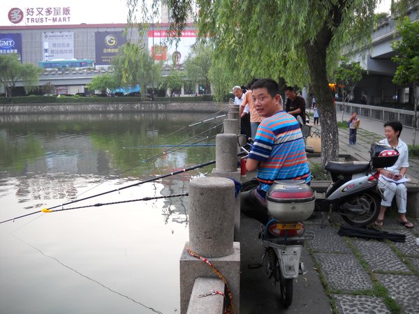 Fisherman in Downtown Hangzhou