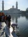 Devotees bathing at the Golden Temple
