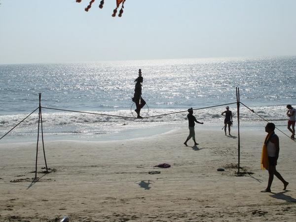 Tightrope walker on the beach