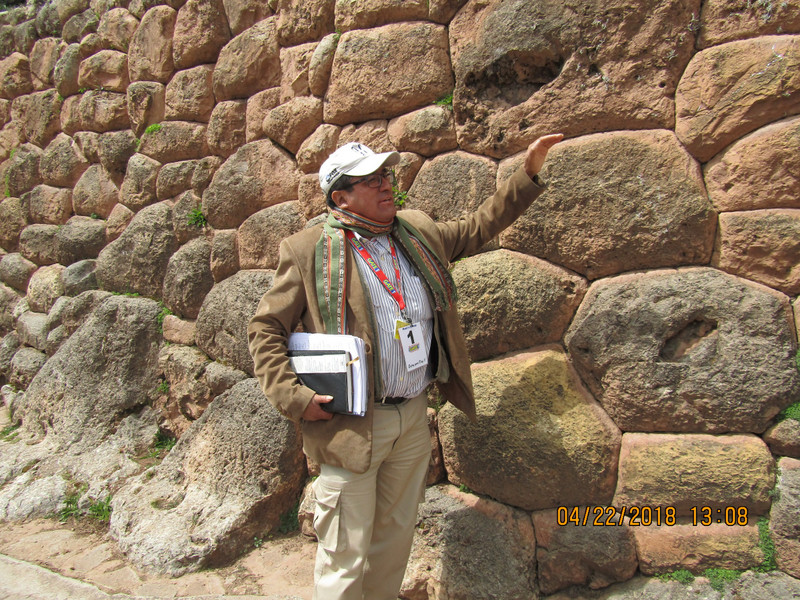 Raul showing the original Inca wall no mortar