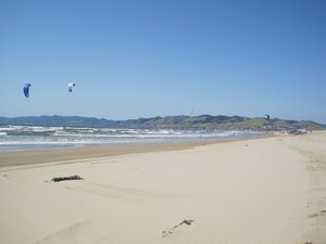 Kite surfers on very windy Pismo Beach