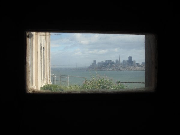 Lookin at the city from a little Alcatraz window