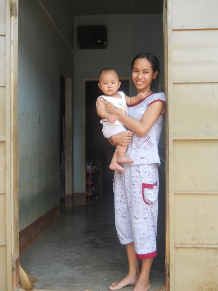 A 25 years old vietnamese with her 8 months baby boy