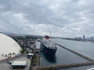 We are finally about to board the Carnival Panorama. The dome building is the departure building and you can also see the Queen Mary.
