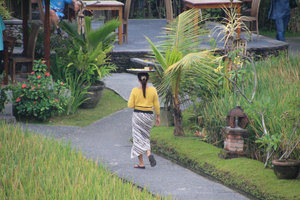 Balinese woman using her head to carry food !