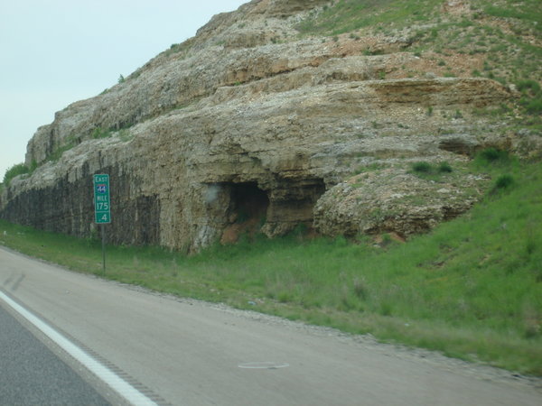 Cave in wall next to highway