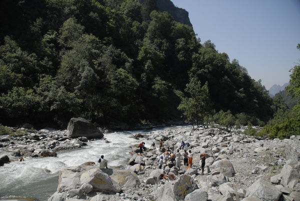 Pilgrims wash at the river enroute