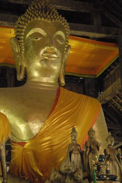 Bronze Buddha at the alter of a Wat...