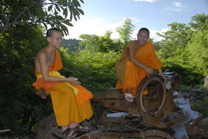 Novice monks Say and Lan on a disguarded American turret gun mounting