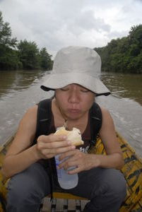 San tucks into her lunch at the start of the trek to avoid carrying it...