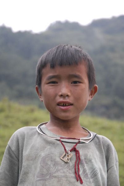 Young Hmong boy shepherd