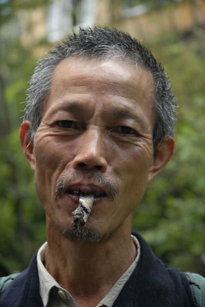 A Zhuang villager on a walk around Ping'An...