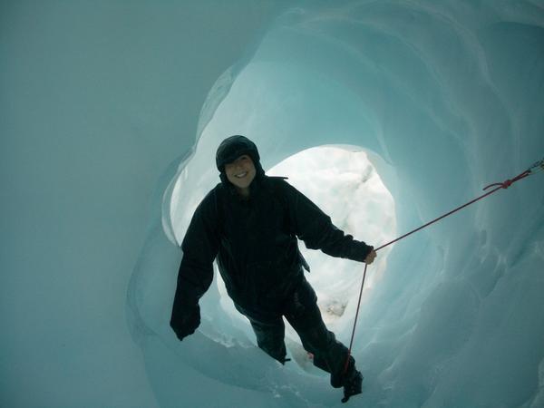 Me climbing through an ice hole