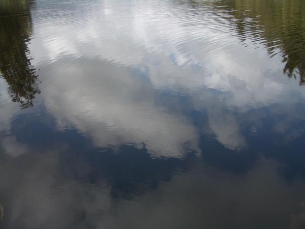 To cloudy for a reflection of the mountains but a good reflection of the clouds!