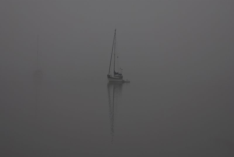 A Sailboat in the Fog