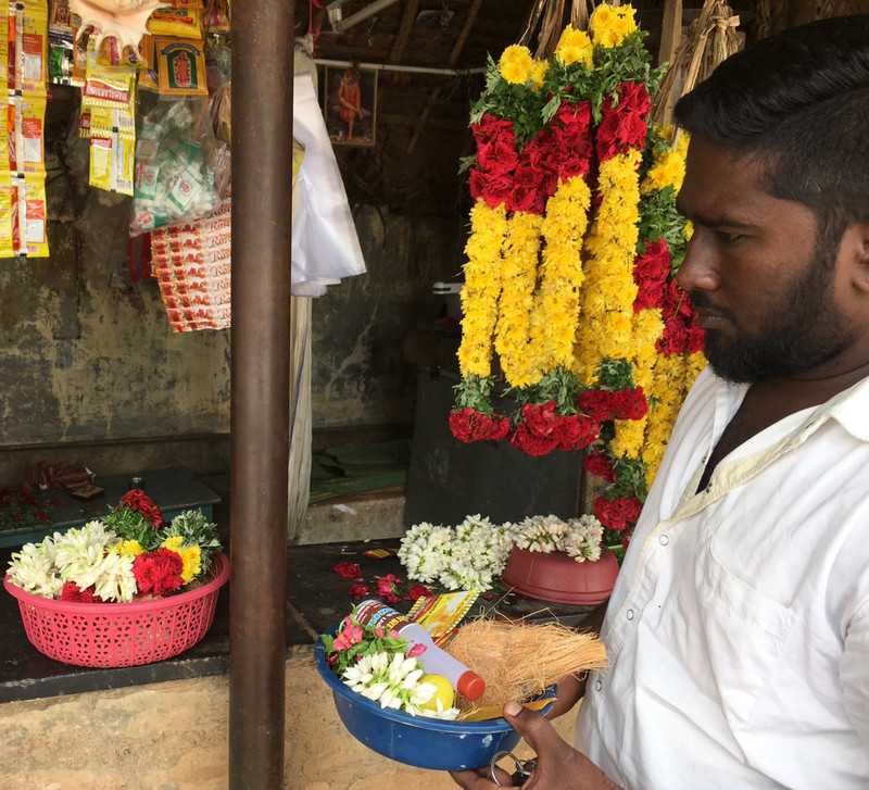 My Driver holds the affordable Puja; the rejected expensive puja is on the counter