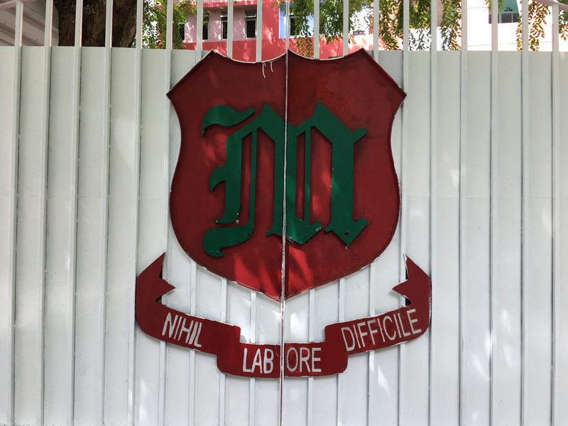 School gate with motto