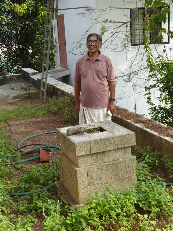 Unnikrishnan stands by the Tulasi planter box