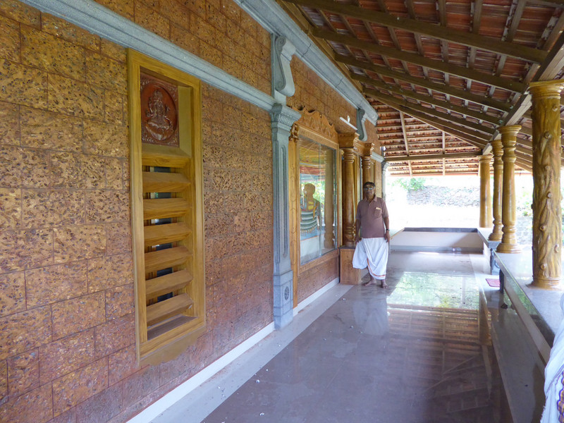 The veranda with concrete pillar in foreground and reclaimed teak pillars