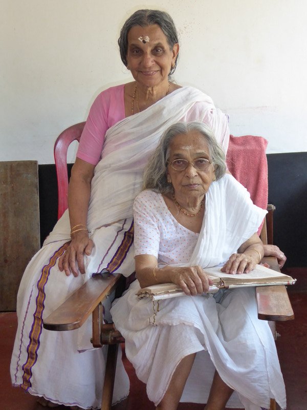 Gouri and older sister Devi, seated