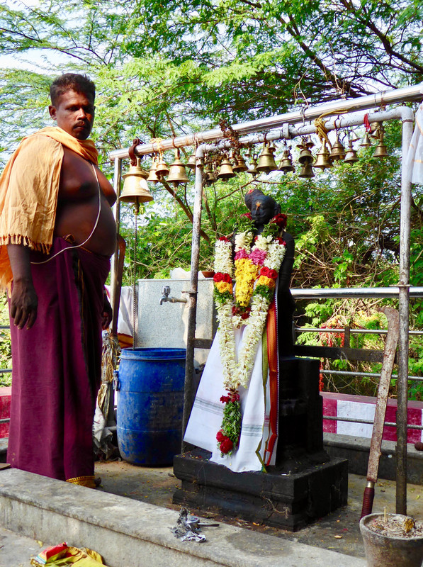 Priest and garlands freshly placed on Karuppa Swami