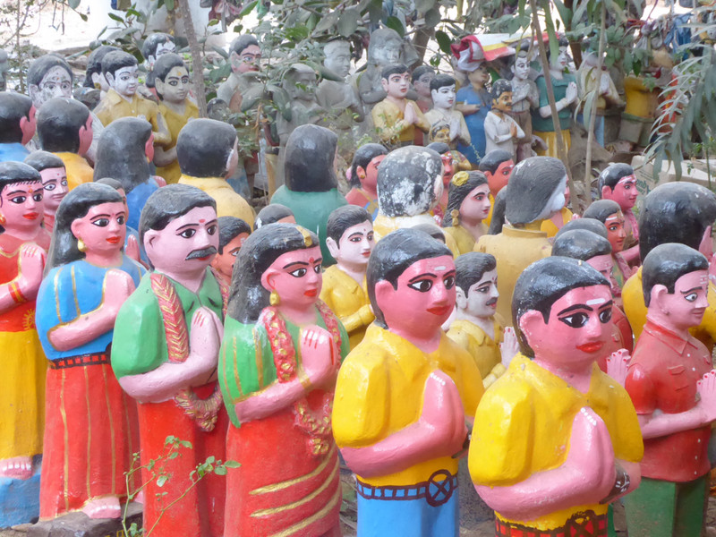 People statues line up at Iruttukal Muniyappan Temple