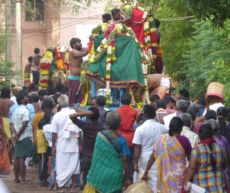 Three procession carts and devotees