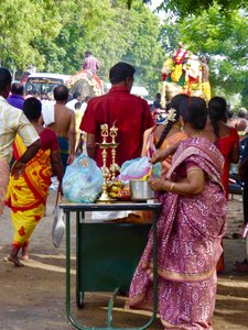 Devotees wait with their offerings