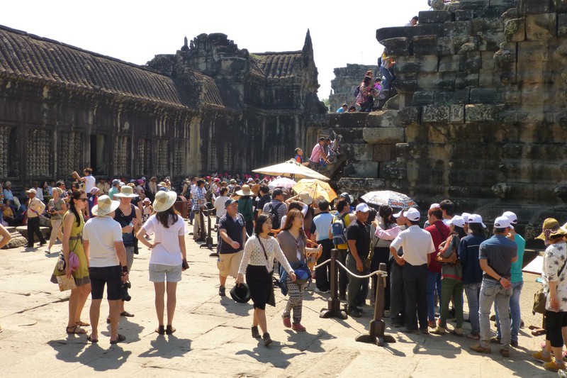 Queuing up to climb the final stairs at Angkor Wat