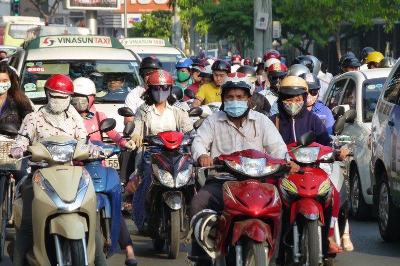 Scooter drivers use face masks to preserve white skin