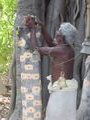 Grandfather/Caretaker of the banyan and deity prepares  puja