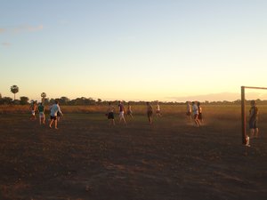 Playing soccer and waiting for the sunset