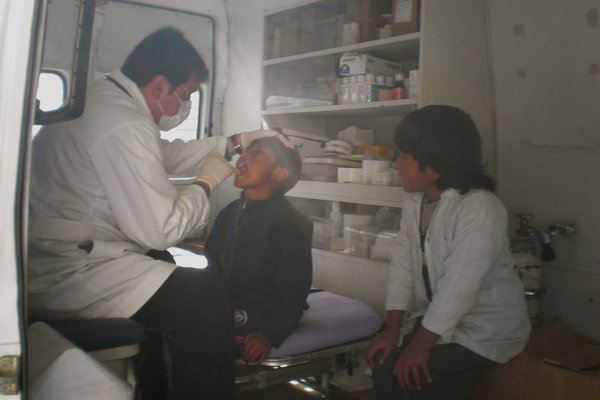 The doctor examining the kids