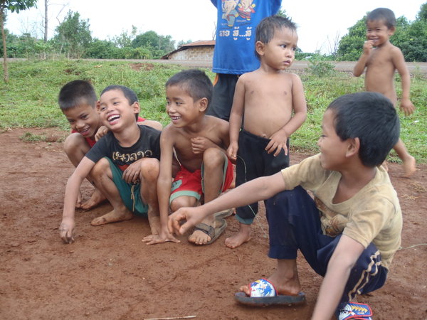 Local kids having a ball playing marbles