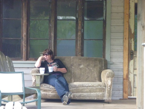Sarah enjoys a coffee on the back verandah