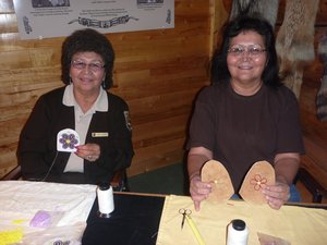 b. The native American ladies doing some traditional beadwork