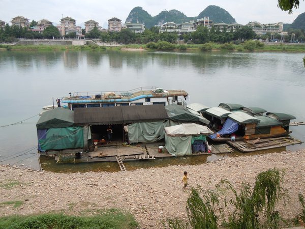 Their Boat House on Li River
