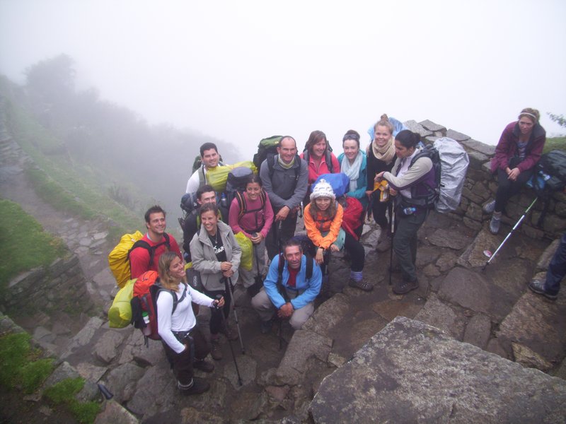 Team on 4th day at Sun Gate, Machu Picchu in the mist behind us