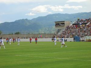 Stadium, Field, and Mountains