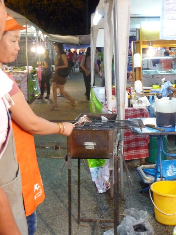 Food market cooking the squid