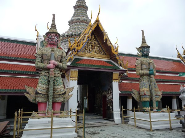the protective demons at the entrance to the wat